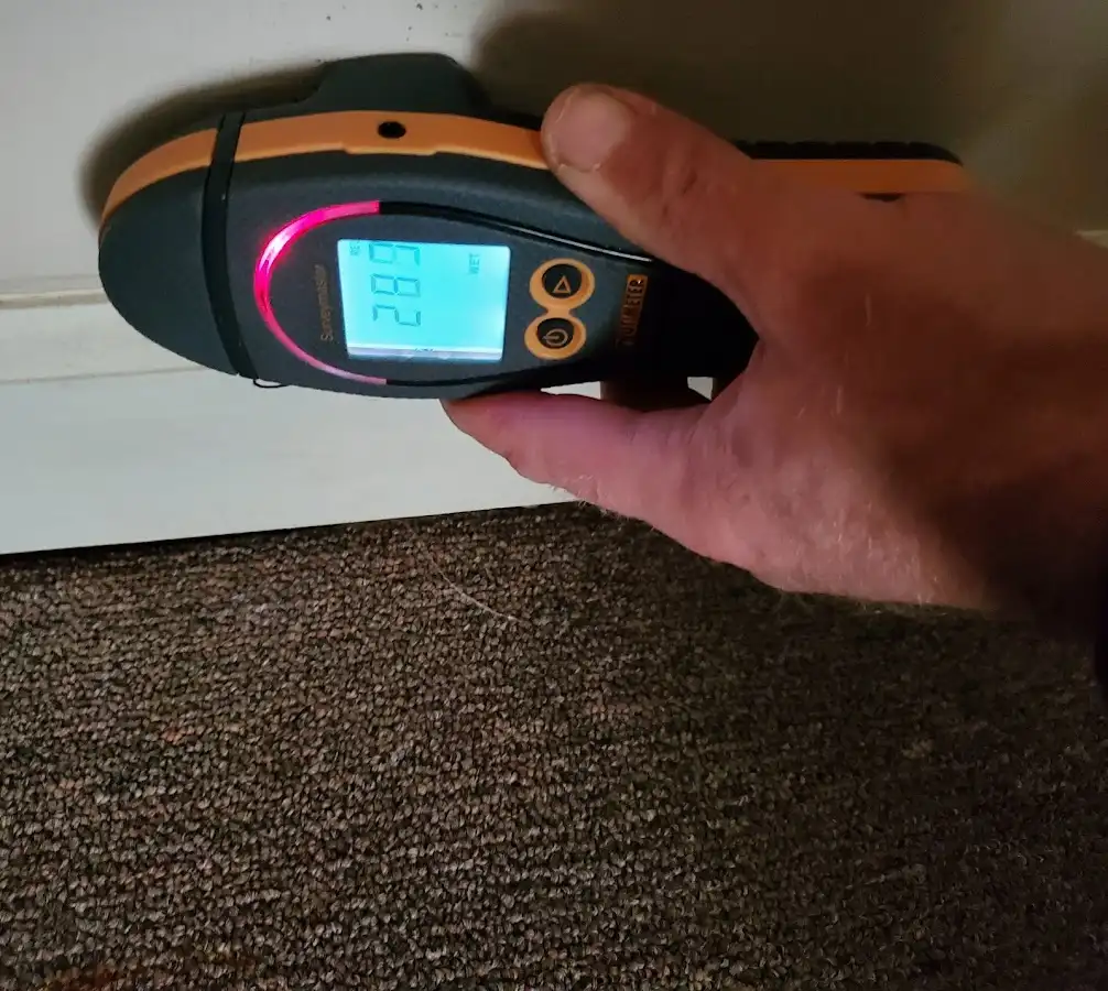 Moisture detection at baseboard during Burst Pipe Cleanup in Norton Shores
